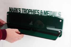 4. Slide shelf into position ensuring front screws on the mounts are not obstructing (Trophy Displays Only) 